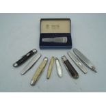 Quantity of folding pocket knives incl a hallmarked silver mother of pearl fruit knife and a boxed