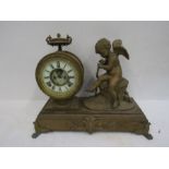A brass ornate cherub clock, needs attention 45cm w x 34cm tall