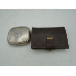 A stainless steel engine turned roll ups cigarette case together with a leather purse and contents