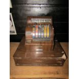 A 1950s walnut cash register