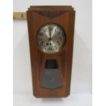 Art deco style wall clock with key and pendulum