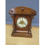 Oak framed mantel clock with key