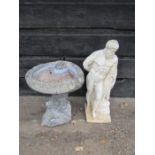 Concrete bird bath and male statue