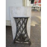 Pair of Singer cast iron table ends and marble top