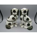 A pair of Staffordshire mantel dogs in green and white