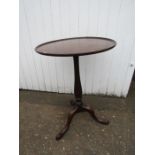 Antique round pedestal side table with metal to feet