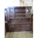 Large Oak Old Charm style dresser with 4 drawers, 4 cupboard doors and 2 glazed doors to top. (