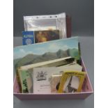 Tray of vintage postcards, lettercards, guide books and visitor photo packs, moon landing FDC and