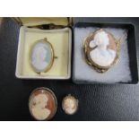 4 cameo brooches 1 marked 800, one silver and one rolled gold and one other