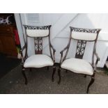 A pair of French walnut chairs circa 1920-s with calico material ready for re-upholstery