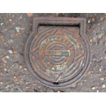 A small manhole cover 25x23cm