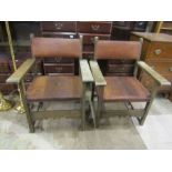 A pair of vintage wood and leather Spanish? chairs