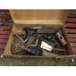 Vintage suitcase containing ironwork including door locks and shoe lasts etc