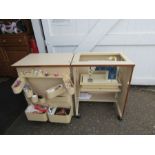 Singer electronic sewing machine in wooden cabinet with contents as pictured