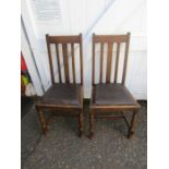 2 oak chairs with vinyl seats