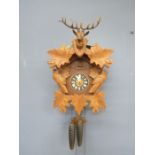 A Black Forest West German cuckoo clock with weights and leaflet 1977