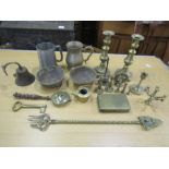 Mixed metalware including brass candlesticks, bell and saving bank etc