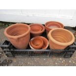 9 terracotta pots