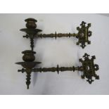 A pair of brass piano wall sconces