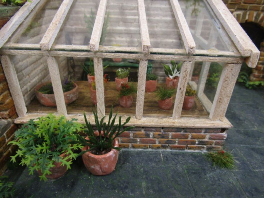 A scratch built walled garden with greenhouse made for Hampton Court Palace RHS flowershow in 1996. - Image 5 of 9