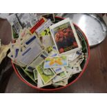 A tin of cigarette cards
