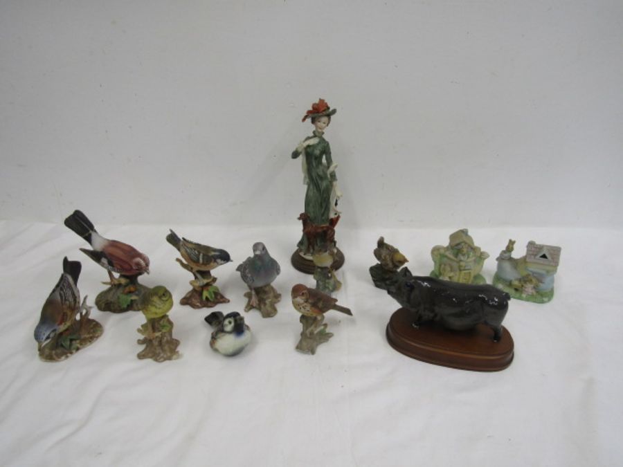 Bird figurines, a pig and a woman figurine