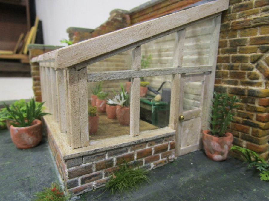A scratch built walled garden with greenhouse made for Hampton Court Palace RHS flowershow in 1996. - Image 6 of 9