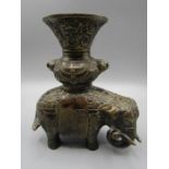 A Bronze elephant insence burner stamped on belly. 18cm high 19cm long