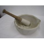 A heavy ceramic poss stone pestle and mortar 10" diameter