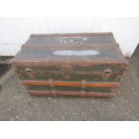 Vintage wooden trunk with metal banding