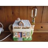 A novelty railway station teapot lamp