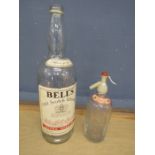 Large Bells Whisky bottle and vintage Rawlings soda water bottle with etched glass