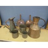 Copper jugs and measuring cups etc