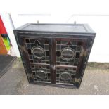 Oak wall cupboard with stained glass doors and key