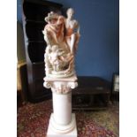 A large bisque water fountain ornament on a large plinth 5ft tall