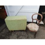 Retro drop leaf kitchen table with Formica top and upholstered mahogany chair