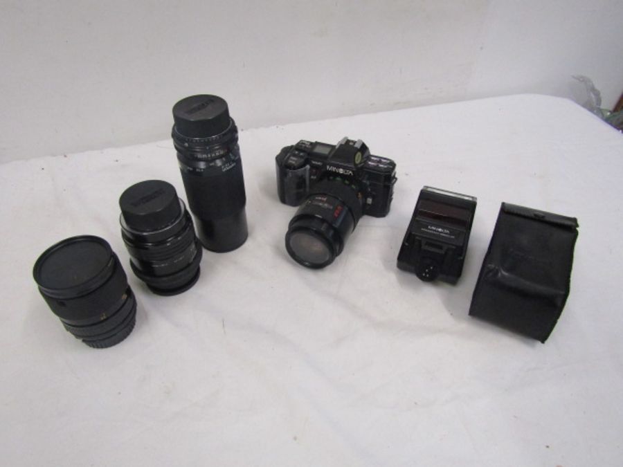 Minolta 7000 camera with 4 lenses, flash and bag