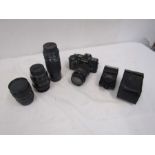 Minolta 7000 camera with 4 lenses, flash and bag