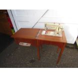 Electronic Singer sewing machine in wooden cabinet