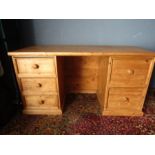 A large pine desk- stripped and waxed