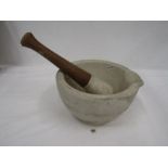 A heavy ceramic poss stone pestle and mortar 8"dia