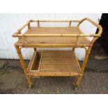 A vintage bamboo and wicker tea trolley