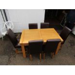 Oak extending dining table with 6 chairs