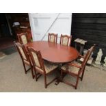 Extending oak dining table with 6 upholstered chairs