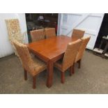 Hardwood extending dining table with 6 rattan chairs (scratched as shown in photos)