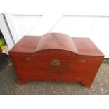 A carved camphor wood Oriental wooden chest with large decorative escutcheon and carved naval and