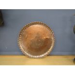 A large Turkish? copper tray stamped on rear 66cm diameter