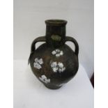 A large vintage painted pottery urn with lid converting it to a lamp