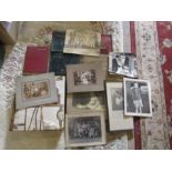 Collection of vintage photo albums, loose photos and photo frames