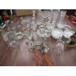 A collection of glassware to include hand painted bottle, vintage bottles, light shades etc etc